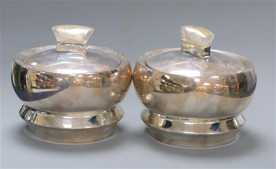 A pair of Indian 925 white metal bowls and covers by Ravissant, the covers with lucite handles, boxed